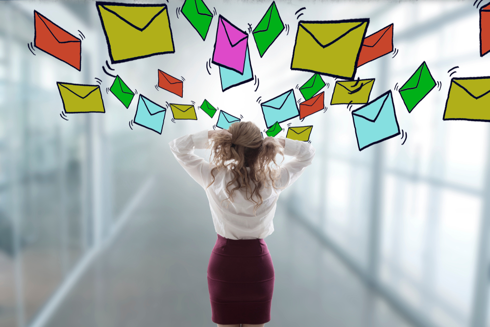 woman stressed out with envelopes over her head