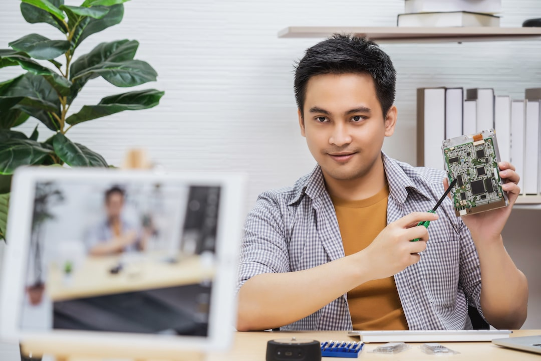 Man showing computer components while videoing