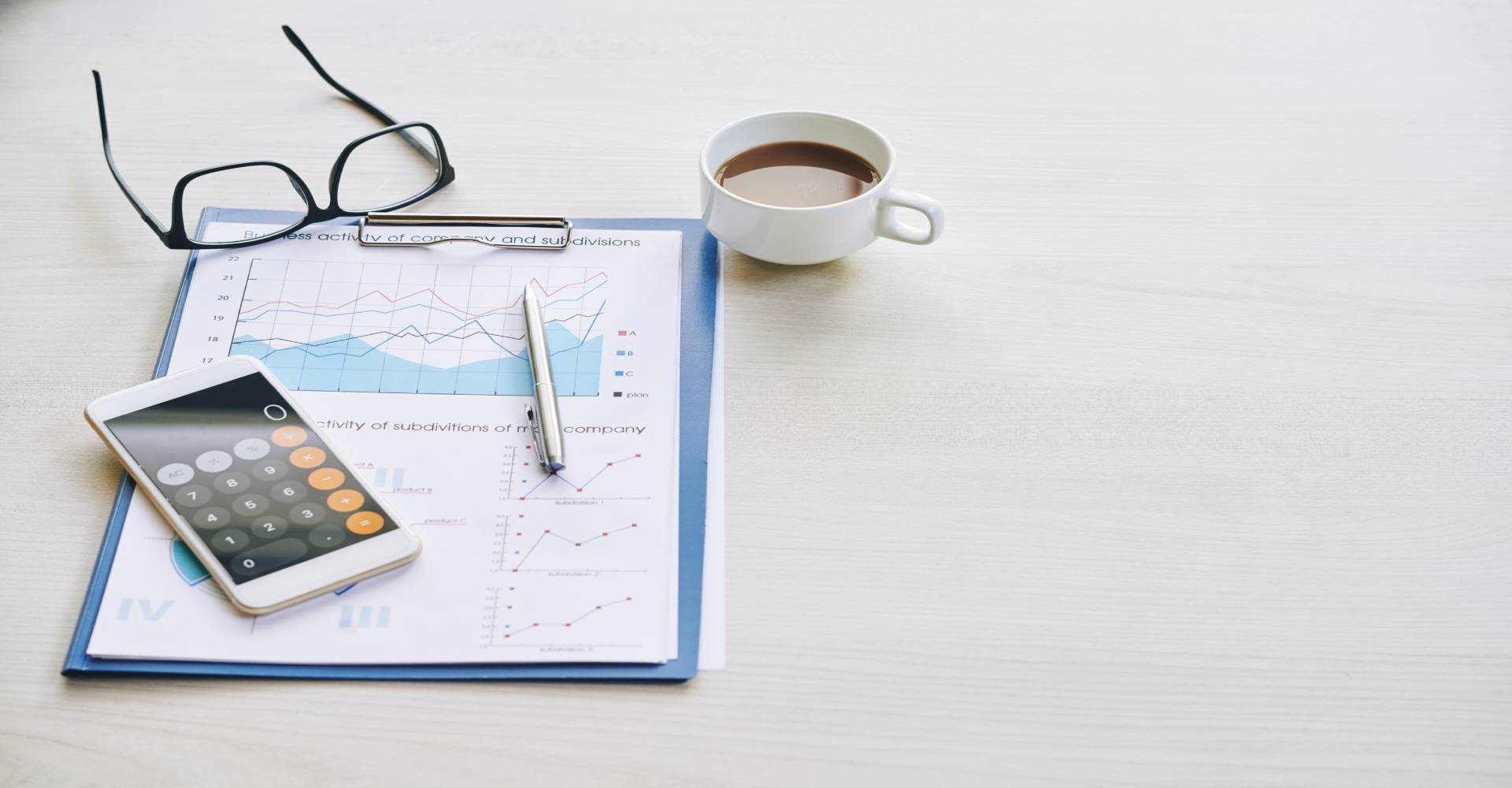 marketing scalability financial chart with cup of coffee and glasses on table