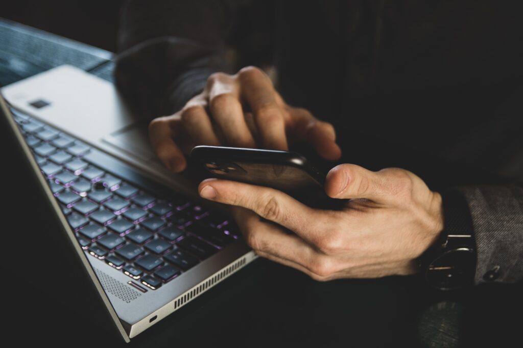 man checking social media captions on smartphone