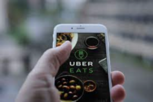 website strategy Uber eats on cellphone display