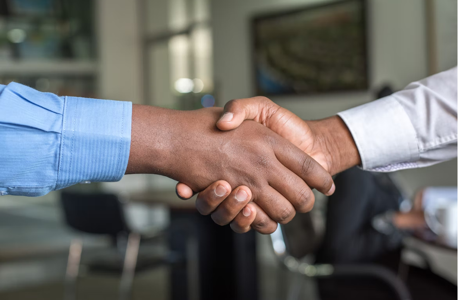 conversion rate optimization business people shaking hands