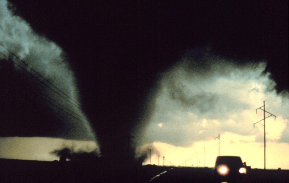 dark funnel tornado on a road